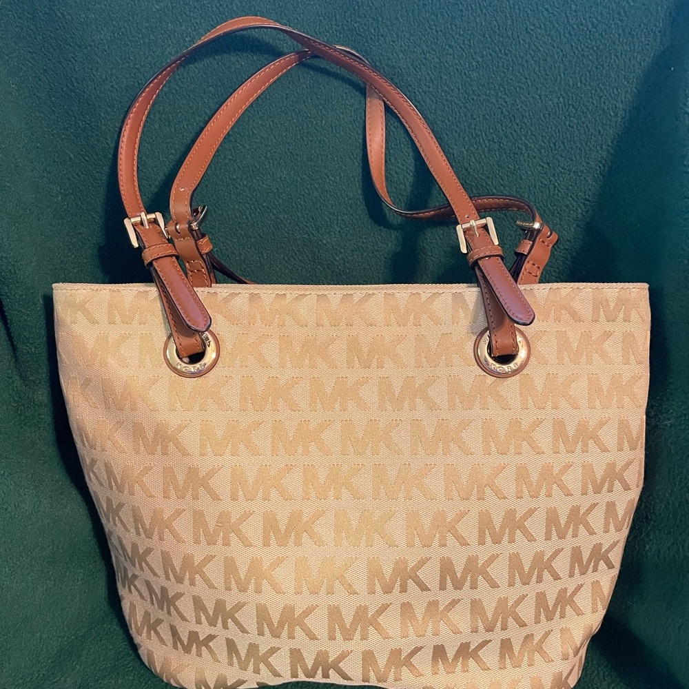 MKors cloth purse-14 1/2” wide and 9” high. Inside pockets-one outside pocket.